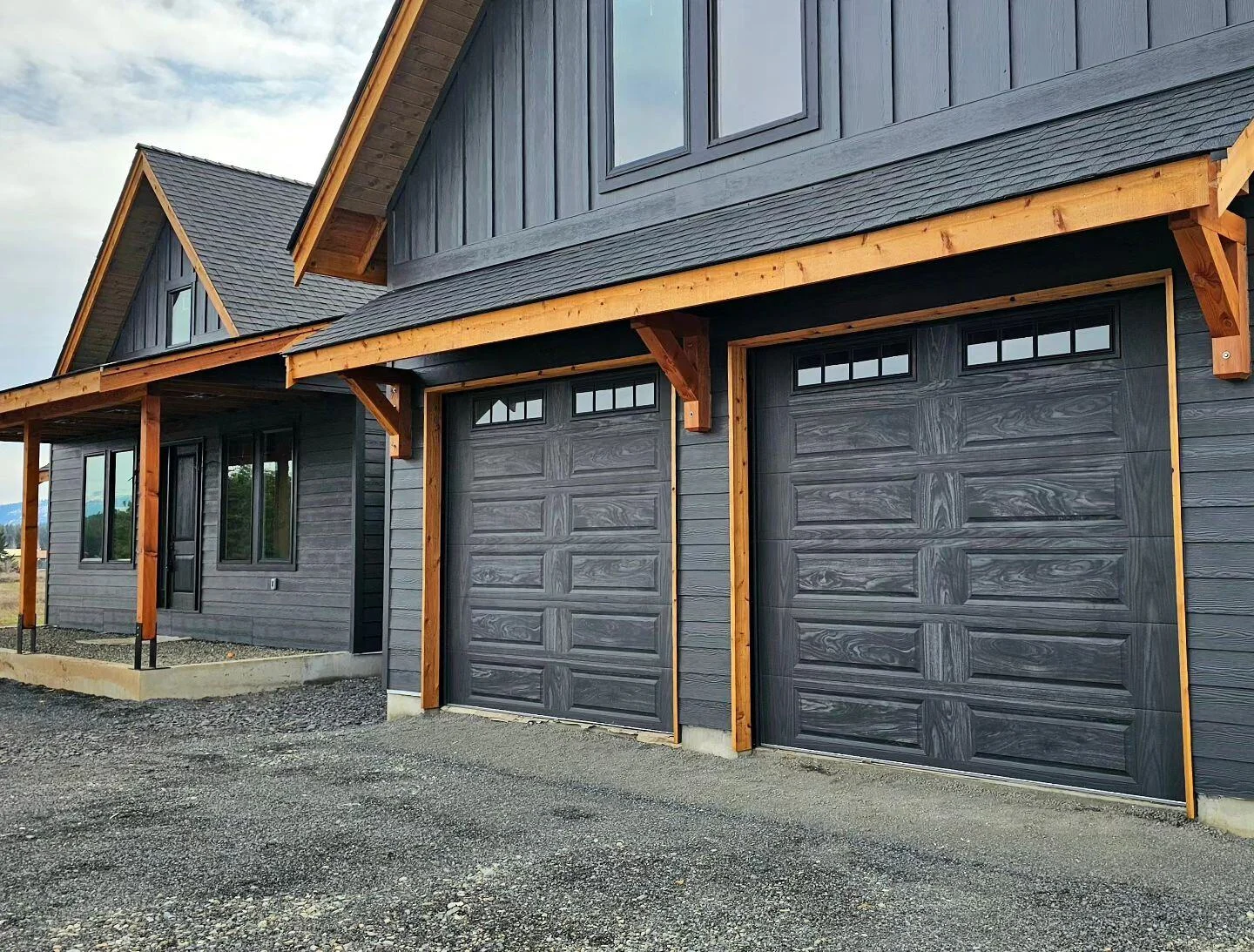 Charcoal CHI garage doors on a modern farmhouse