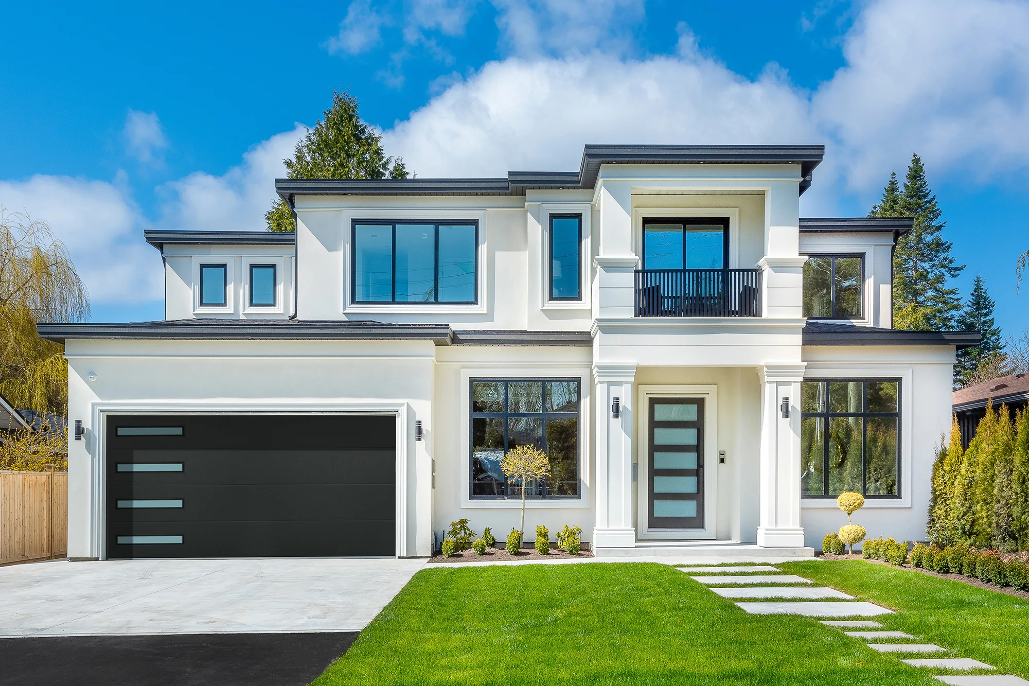 Black flush garage door on a modern home