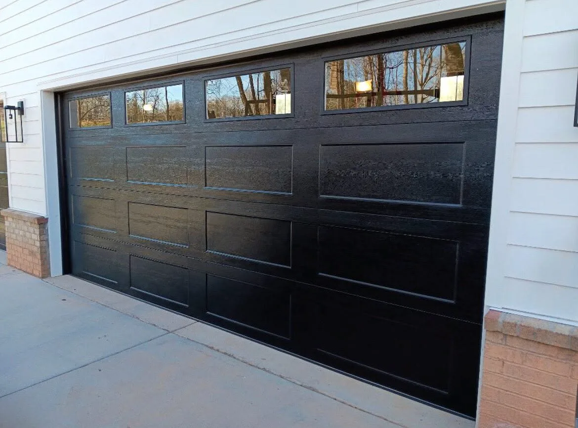 Black garage door with window top section